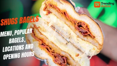 Shugs bagel sandwich filled with melted cheese and crispy meat, featuring the Trending Article logo